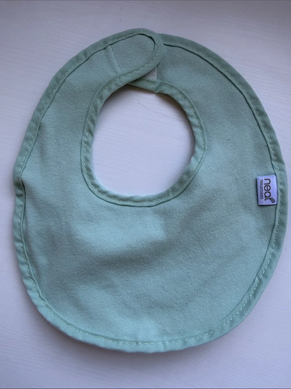 Neat Solutions - 4 pack of Soft Pastel Bibs in Pink Floral, Pastel Blue, & Mint